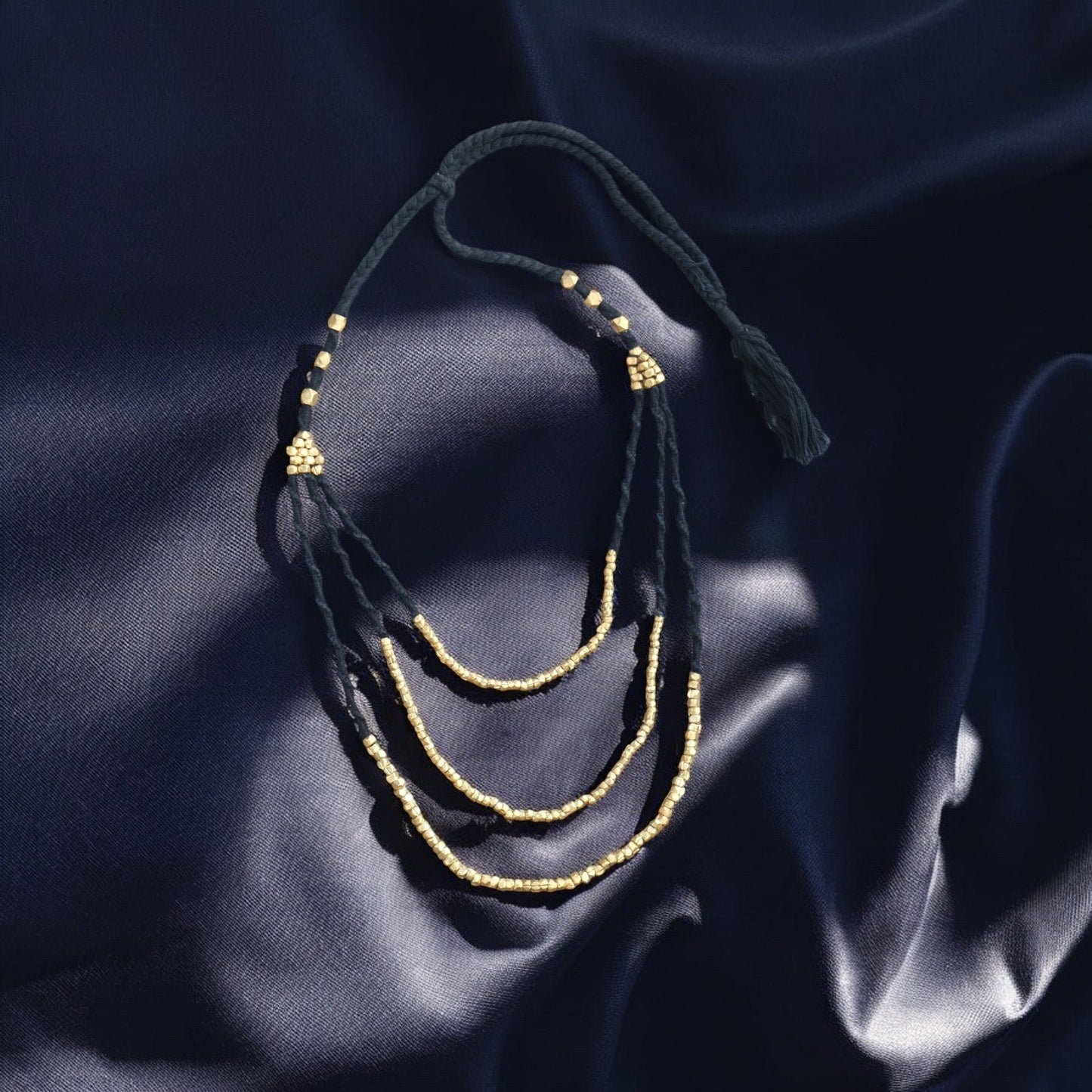Handcrafted Dhokra beaded choker necklace with geometric brass beads; ethically made by Odisha artisans using ancient lost-wax casting. A sustainable bohemian statement piece for v-neck tops or ethnic dresses by KalaKart