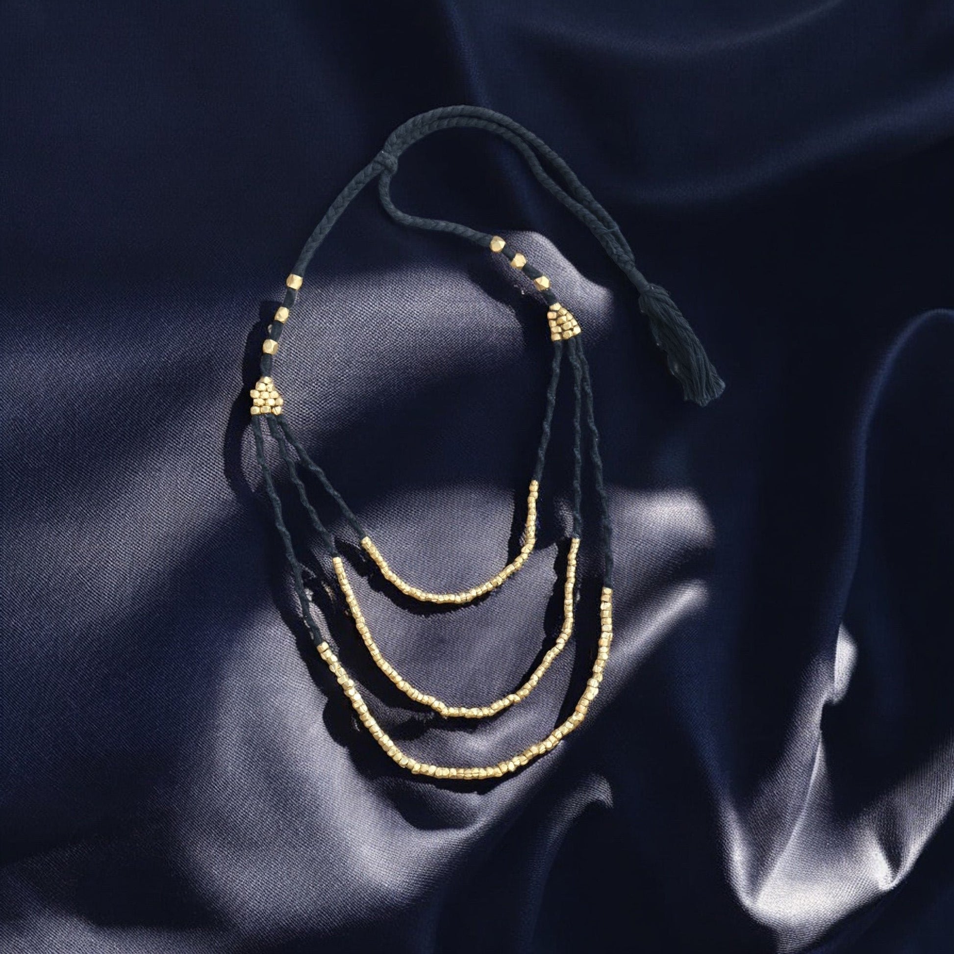 Handcrafted Dhokra beaded choker necklace with geometric brass beads; ethically made by Odisha artisans using ancient lost-wax casting. A sustainable bohemian statement piece for v-neck tops or ethnic dresses by KalaKart
