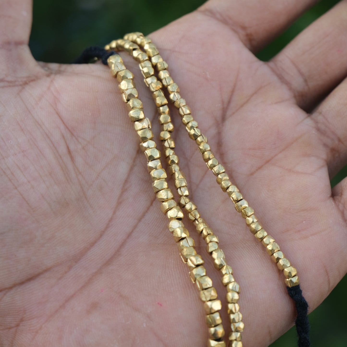Handcrafted Dhokra beaded choker necklace with geometric brass beads; ethically made by Odisha artisans using ancient lost-wax casting. A sustainable bohemian statement piece for v-neck tops or ethnic dresses by KalaKart