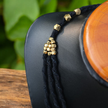 Handcrafted Dhokra beaded choker necklace with geometric brass beads; ethically made by Odisha artisans using ancient lost-wax casting. A sustainable bohemian statement piece for v-neck tops or ethnic dresses by KalaKart