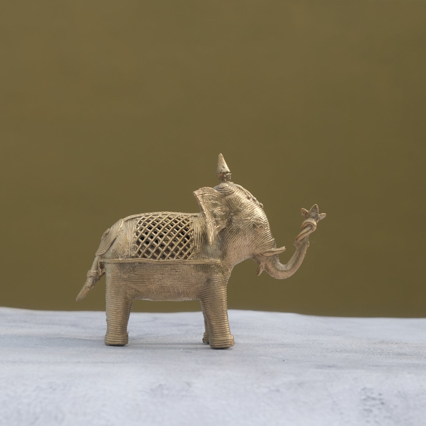 Nuagaon Dhokra Elephant Holding Lotus — Handcrafted Lost-Wax Brass Showpiece