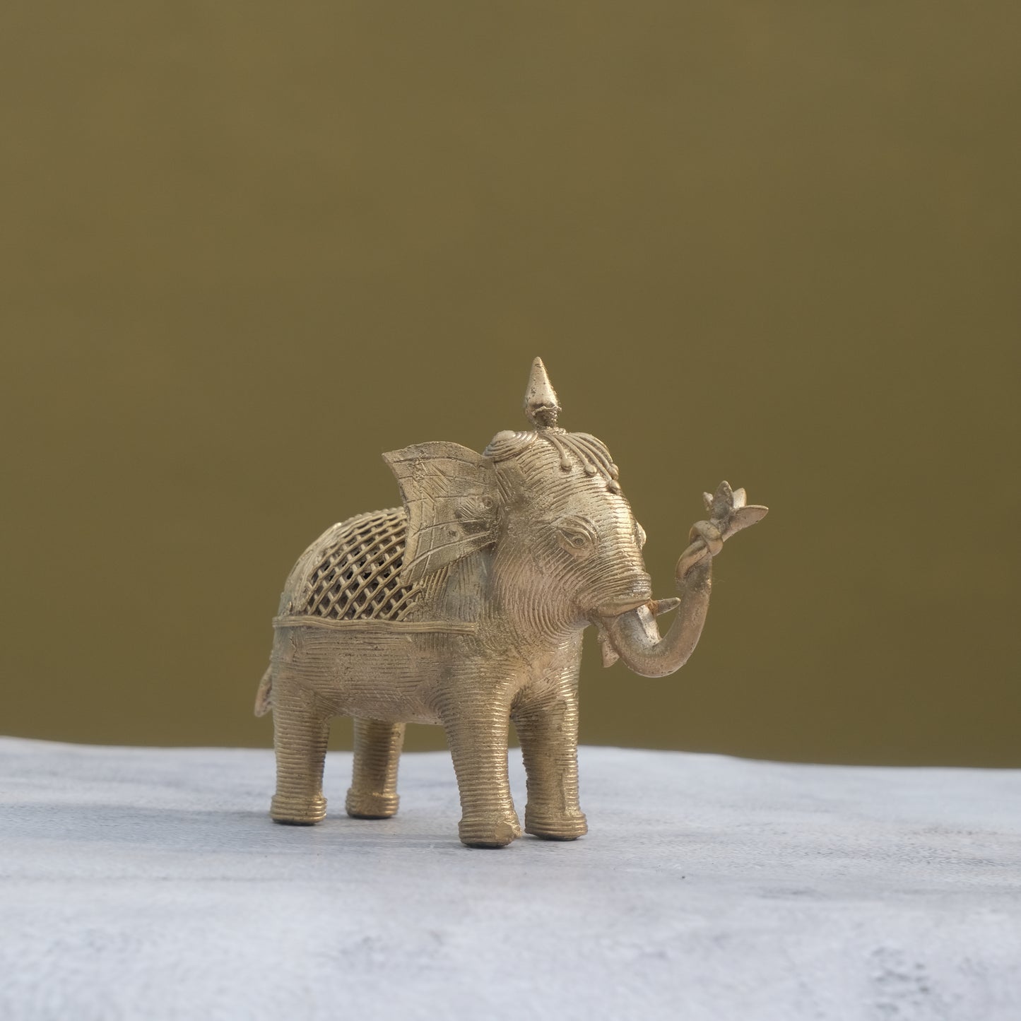 Nuagaon Dhokra Elephant Holding Lotus — Handcrafted Lost-Wax Brass Showpiece