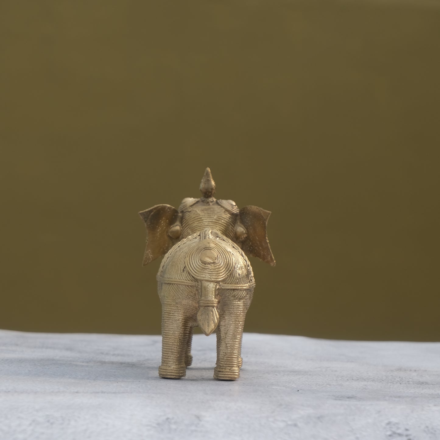 Nuagaon Dhokra Elephant Holding Lotus — Handcrafted Lost-Wax Brass Showpiece