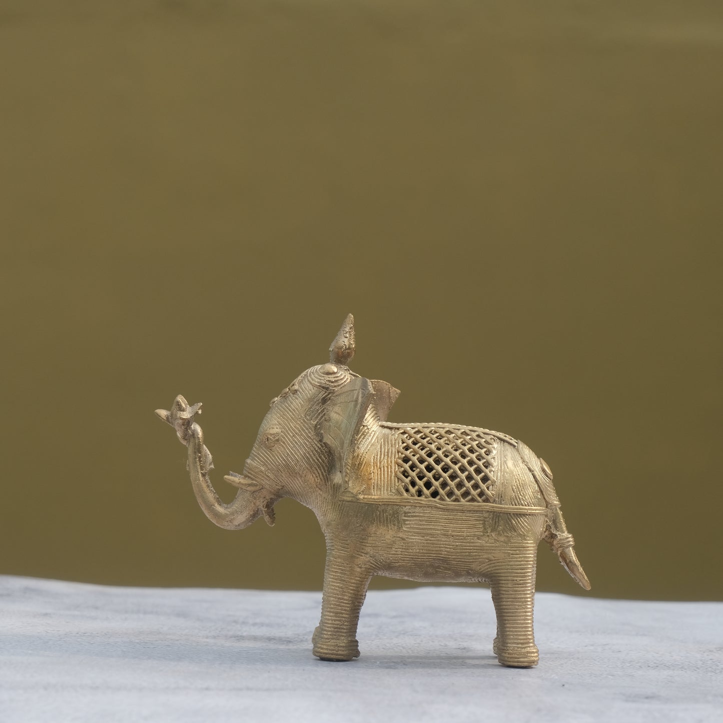 Nuagaon Dhokra Elephant Holding Lotus — Handcrafted Lost-Wax Brass Showpiece
