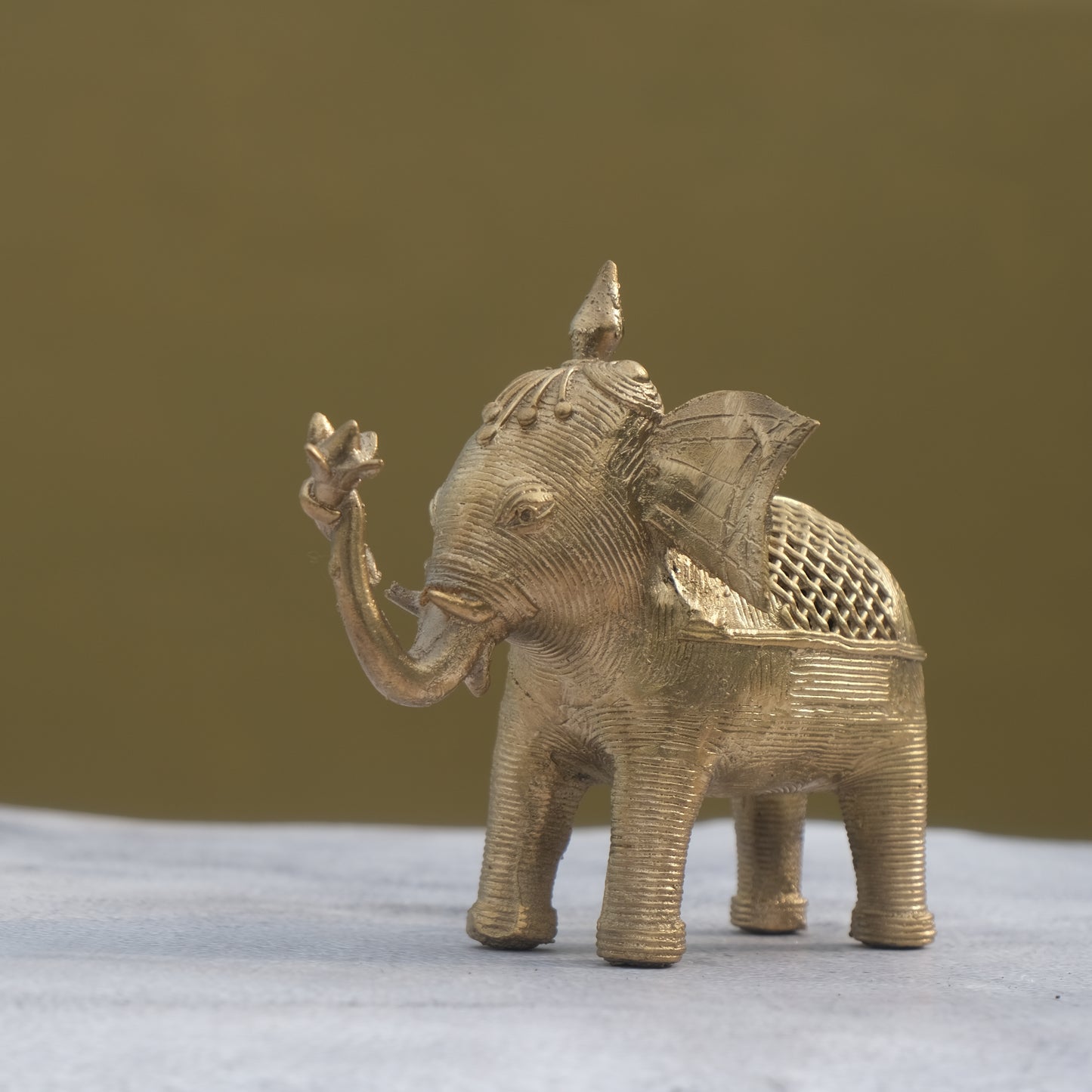 Nuagaon Dhokra Elephant Holding Lotus — Handcrafted Lost-Wax Brass Showpiece