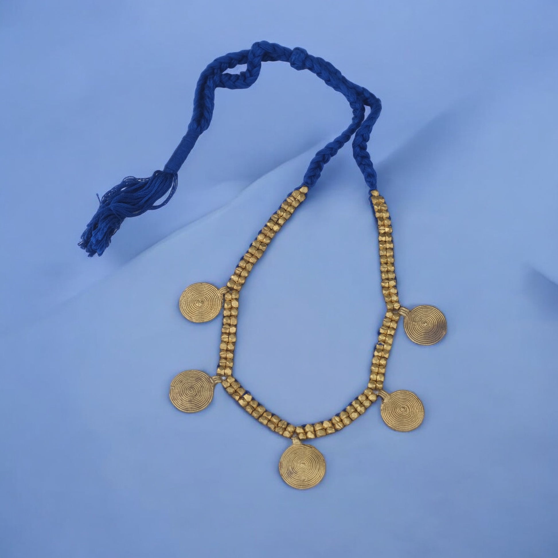 Handcrafted Dhokra golden beaded necklace featuring a circular design; ethically made by Odisha artisans using ancient lost-wax casting. A sustainable everyday statement piece for white linen shirts or tunics by KalaKart