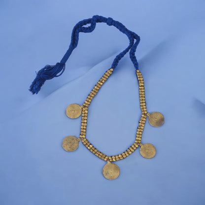 Handcrafted Dhokra golden beaded necklace featuring a circular design; ethically made by Odisha artisans using ancient lost-wax casting. A sustainable everyday statement piece for white linen shirts or tunics by KalaKart
