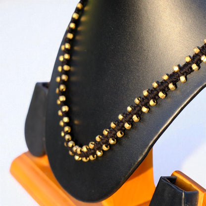 Handcrafted Dhokra beaded necklace with a tribal design; ethically made by Odisha artisans using ancient lost-wax casting. A sustainable festive statement piece for handloom sarees by KalaKart.