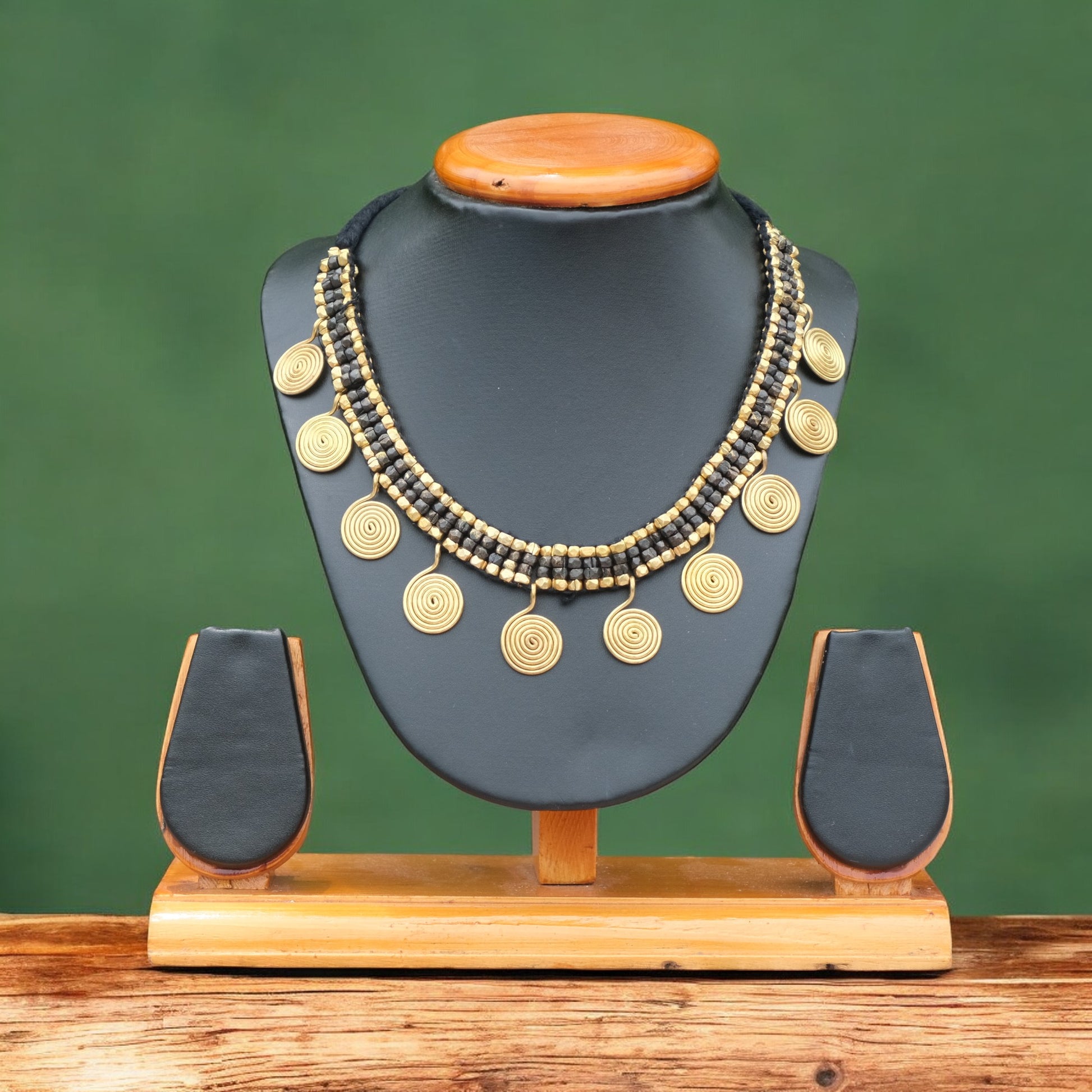 Handcrafted Golden and black Dhokra beaded necklace with a tribal design; ethically made by Odisha artisans using ancient lost-wax casting. A sustainable festive statement piece for handloom sarees by KalaKart.