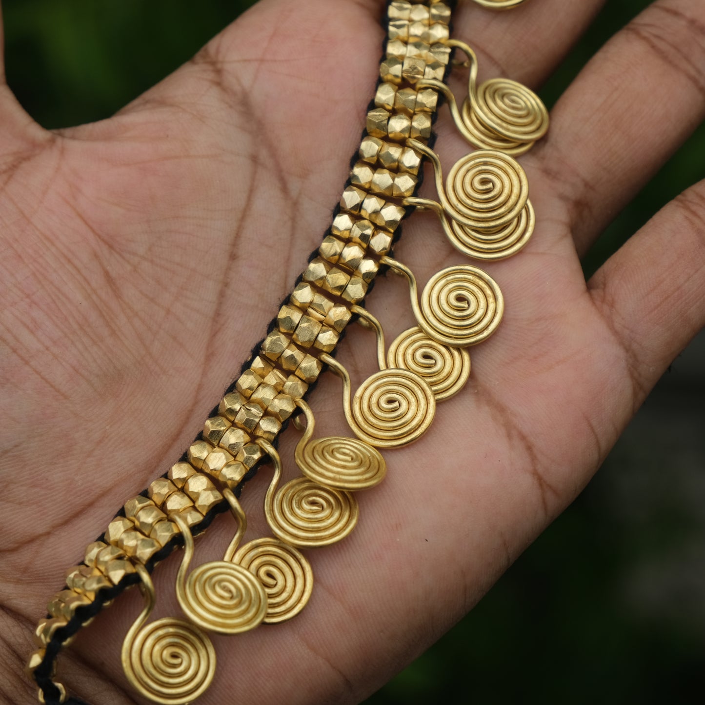 Handcrafted Golden Dhokra beaded necklace with a tribal design; ethically made by Odisha artisans using ancient lost-wax casting. A sustainable festive statement piece for handloom sarees by KalaKart.