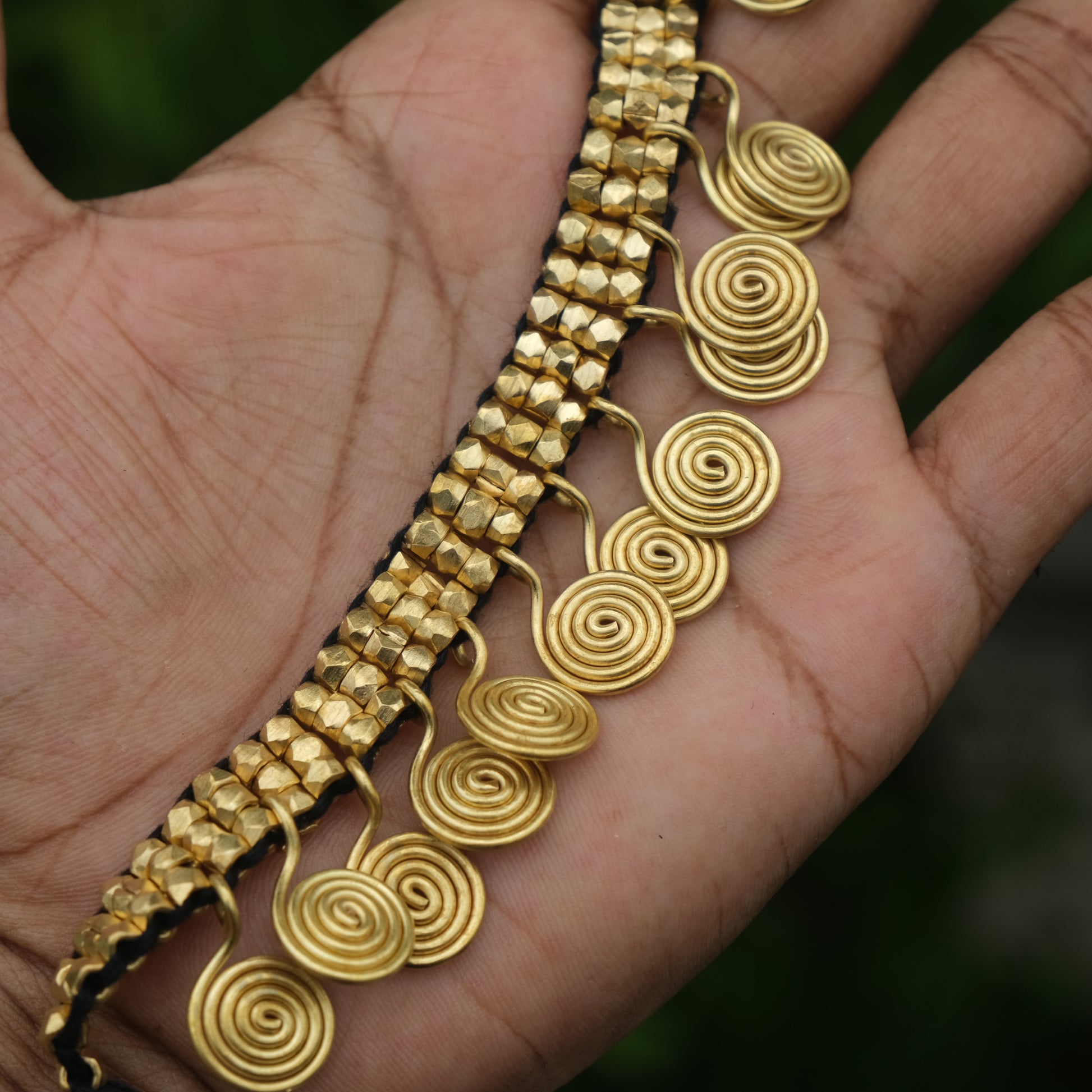 Handcrafted Golden Dhokra beaded necklace with a tribal design; ethically made by Odisha artisans using ancient lost-wax casting. A sustainable festive statement piece for handloom sarees by KalaKart.