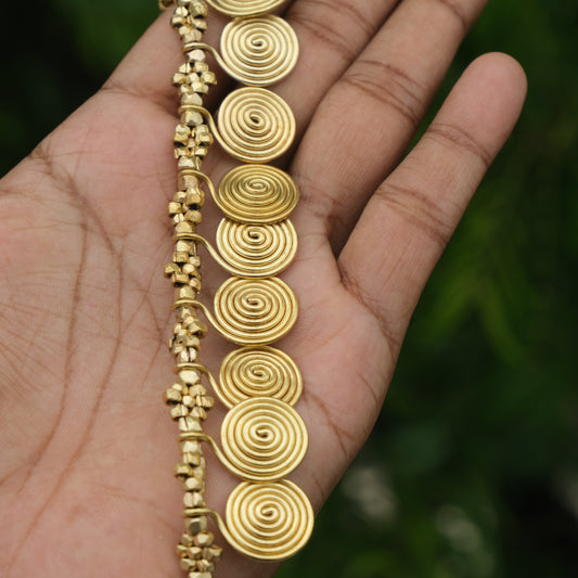Handcrafted Dhokra golden beaded necklace featuring a circular design; ethically made by Odisha artisans using ancient lost-wax casting. A sustainable everyday statement piece for white linen shirts or tunics by KalaKart