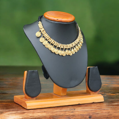 Handcrafted Golden Dhokra beaded necklace with a tribal design; ethically made by Odisha artisans using ancient lost-wax casting. A sustainable festive statement piece for handloom sarees by KalaKart.