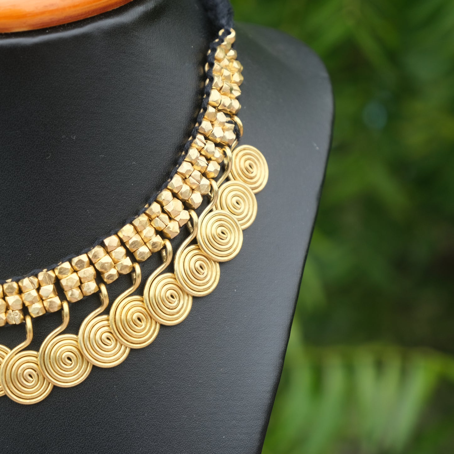 Handcrafted Golden Dhokra beaded necklace with a tribal design; ethically made by Odisha artisans using ancient lost-wax casting. A sustainable festive statement piece for handloom sarees by KalaKart.