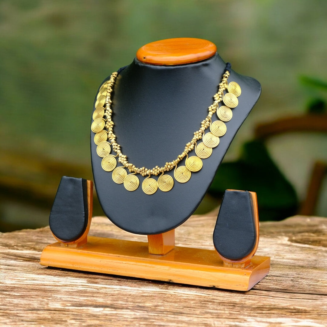 Handcrafted Dhokra golden beaded necklace featuring a circular design; ethically made by Odisha artisans using ancient lost-wax casting. A sustainable everyday statement piece for white linen shirts or tunics by KalaKart