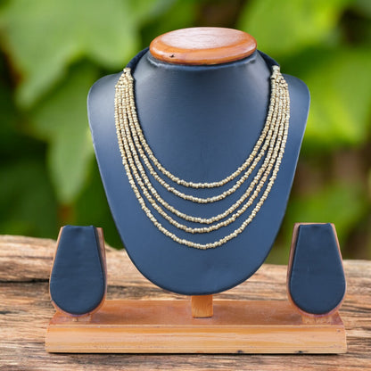 Handcrafted Dhokra beaded choker necklace with geometric brass beads; ethically made by Odisha artisans using ancient lost-wax casting. A sustainable bohemian statement piece for v-neck tops or ethnic dresses by KalaKart.