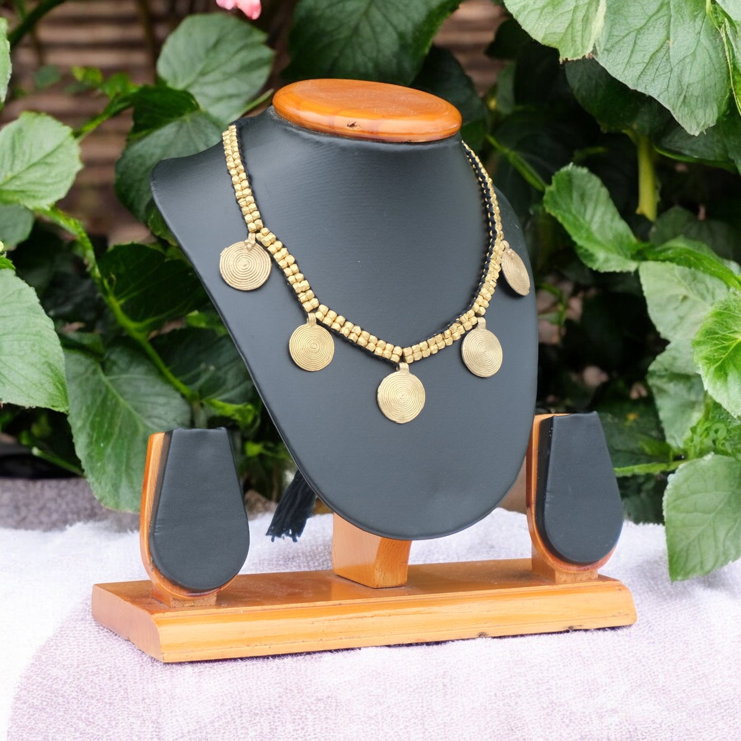 Handcrafted Dhokra golden beaded necklace featuring a circular design; ethically made by Odisha artisans using ancient lost-wax casting. A sustainable everyday statement piece for white linen shirts or tunics by KalaKart