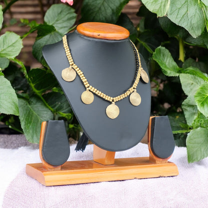 Handcrafted Dhokra golden beaded necklace featuring a circular design; ethically made by Odisha artisans using ancient lost-wax casting. A sustainable everyday statement piece for white linen shirts or tunics by KalaKart