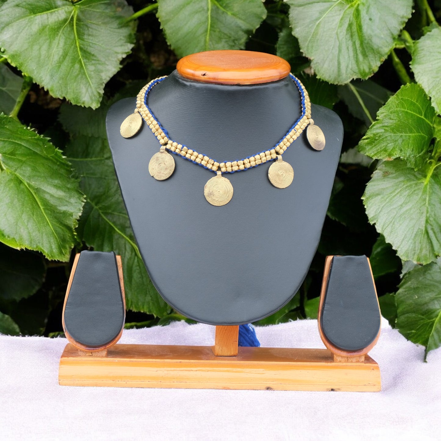Handcrafted Dhokra golden beaded necklace featuring a circular design; ethically made by Odisha artisans using ancient lost-wax casting. A sustainable everyday statement piece for white linen shirts or tunics by KalaKart