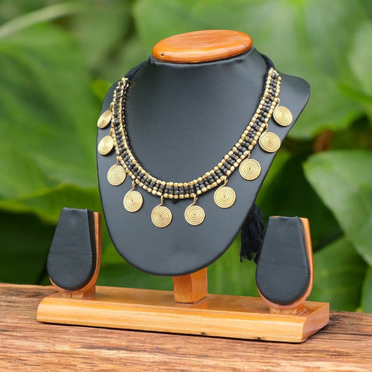 Handcrafted Golden and black Dhokra beaded necklace with a tribal design; ethically made by Odisha artisans using ancient lost-wax casting. A sustainable festive statement piece for handloom sarees by KalaKart.