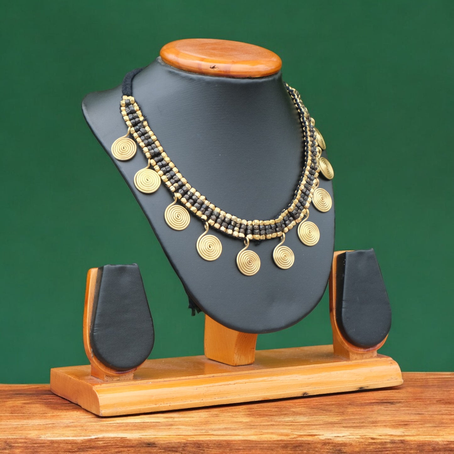 Handcrafted Golden and black Dhokra beaded necklace with a tribal design; ethically made by Odisha artisans using ancient lost-wax casting. A sustainable festive statement piece for handloom sarees by KalaKart.
